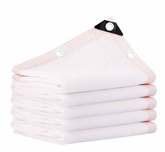 Stack of white towels with a black clip on a white background